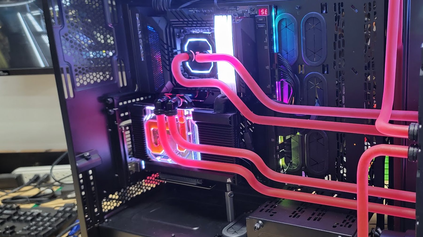 Custom gaming PC with hand-bent red hardline water cooling loop