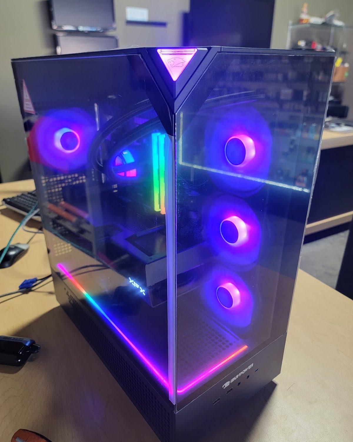 Compact gaming PC with purple and pink RGB lighting