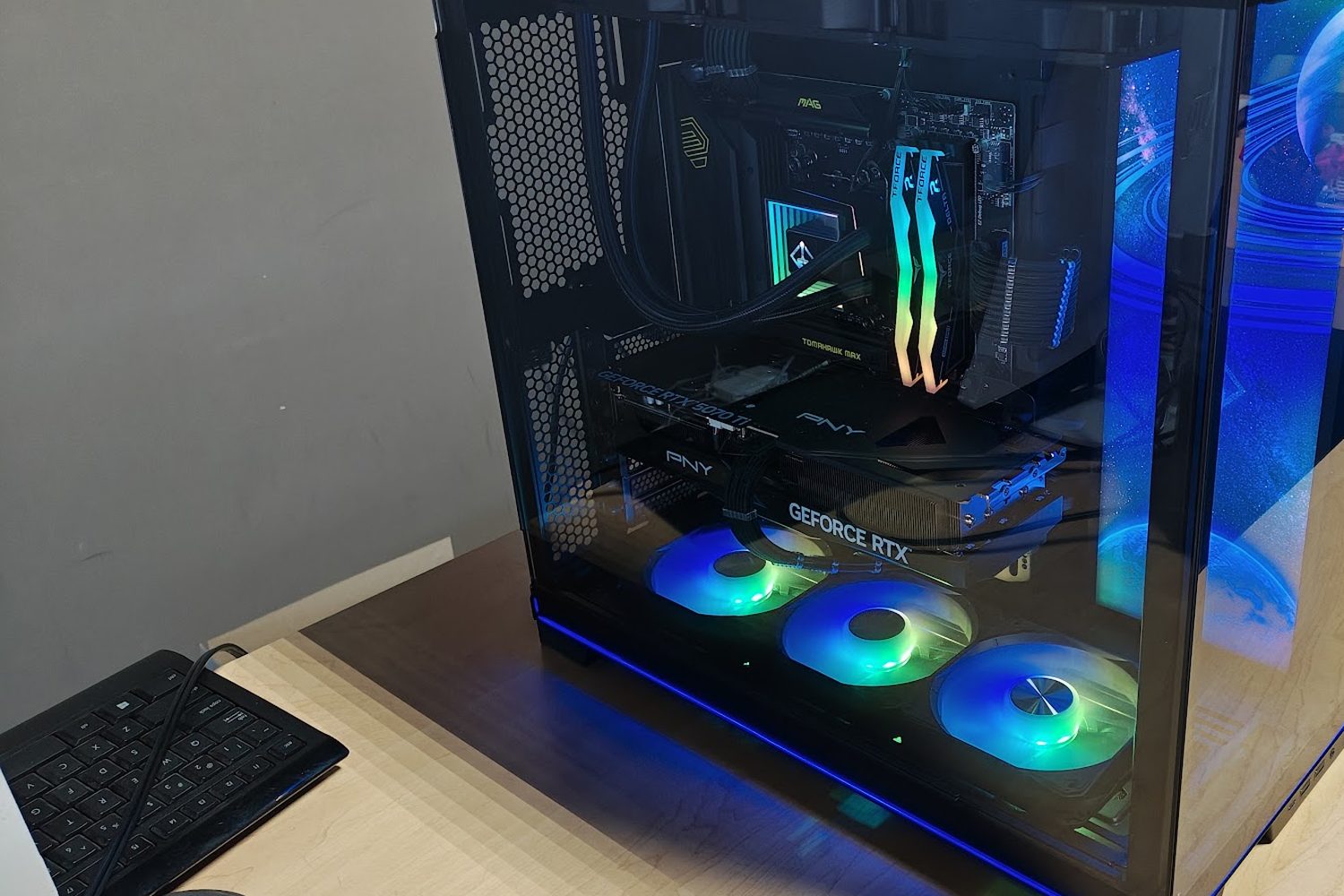 Black gaming PC with GeForce RTX graphics card and green RGB fans