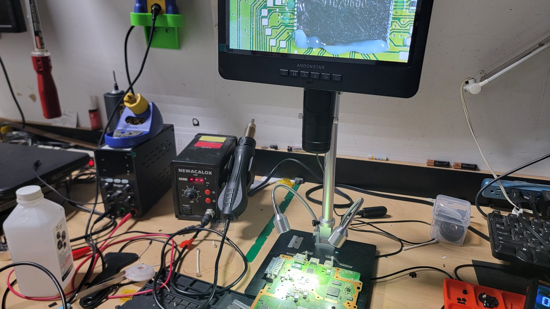 A PlayStation board under the microscope at Advanced Computers, showing the Panasonic HDMI encoder IC